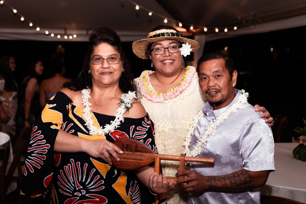 Kahaunani Mahoe-Thoene (center), servicing director, Hawaiʻi Community Lending with Pumehana Kekumu (left) after she received one of the homeowner ʻōhana awards presented at Hui Waiwai 2025.